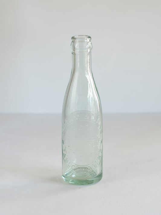 Cottam & Sons   Embossed Glass Bottle