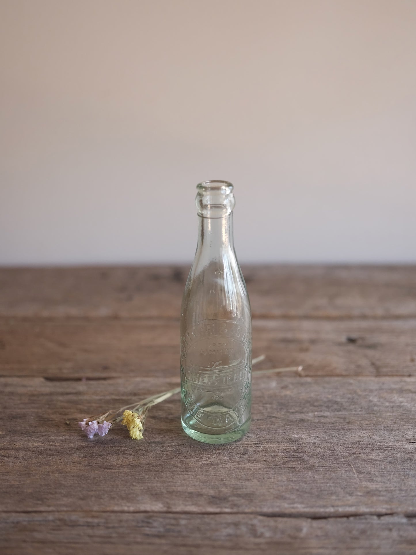Cottam & Sons   Embossed Glass Bottle
