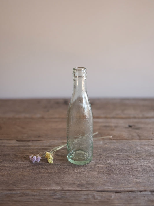 Cottam & Sons   Embossed Glass Bottle