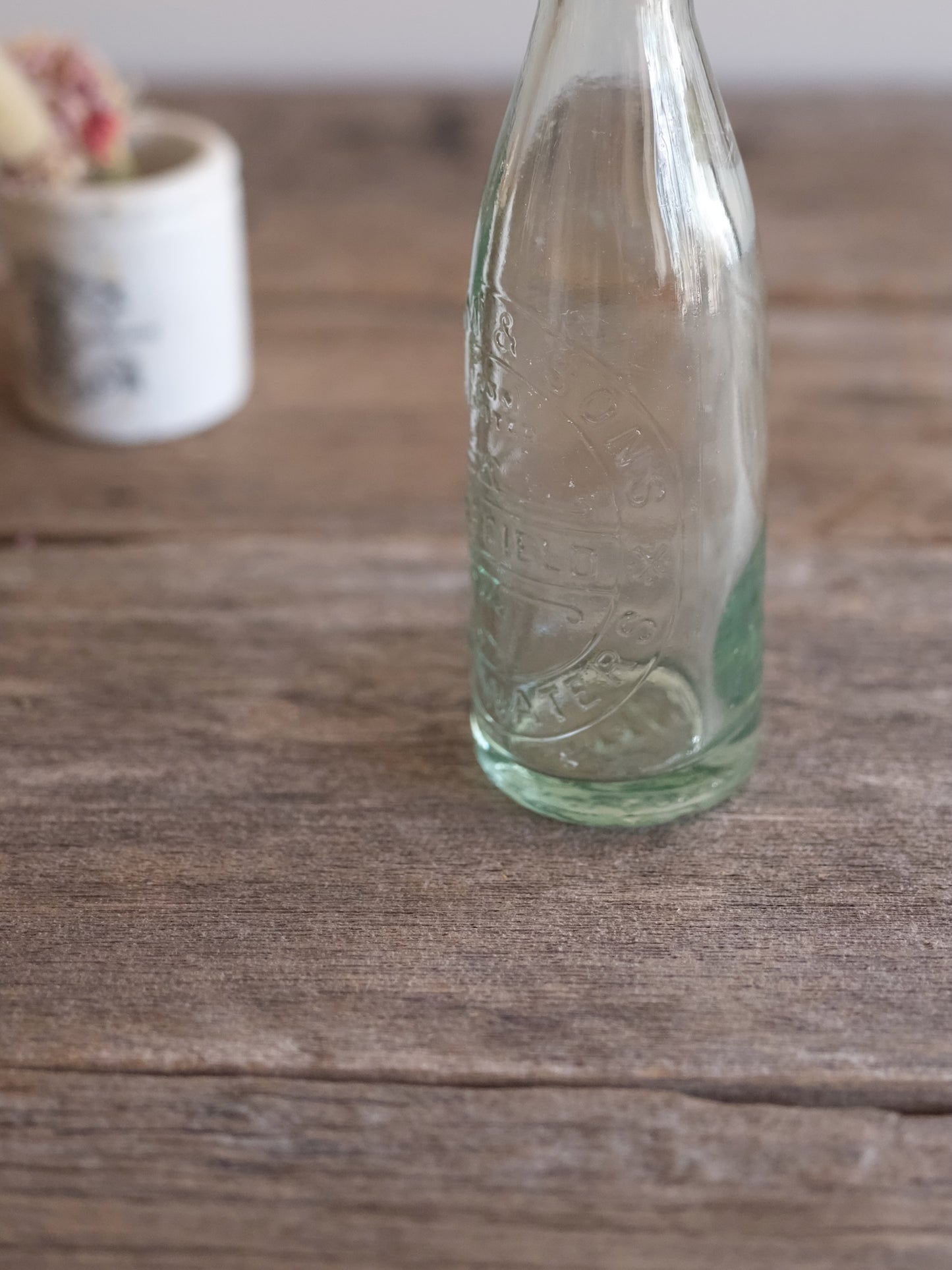 Cottam & Sons   Embossed Glass Bottle