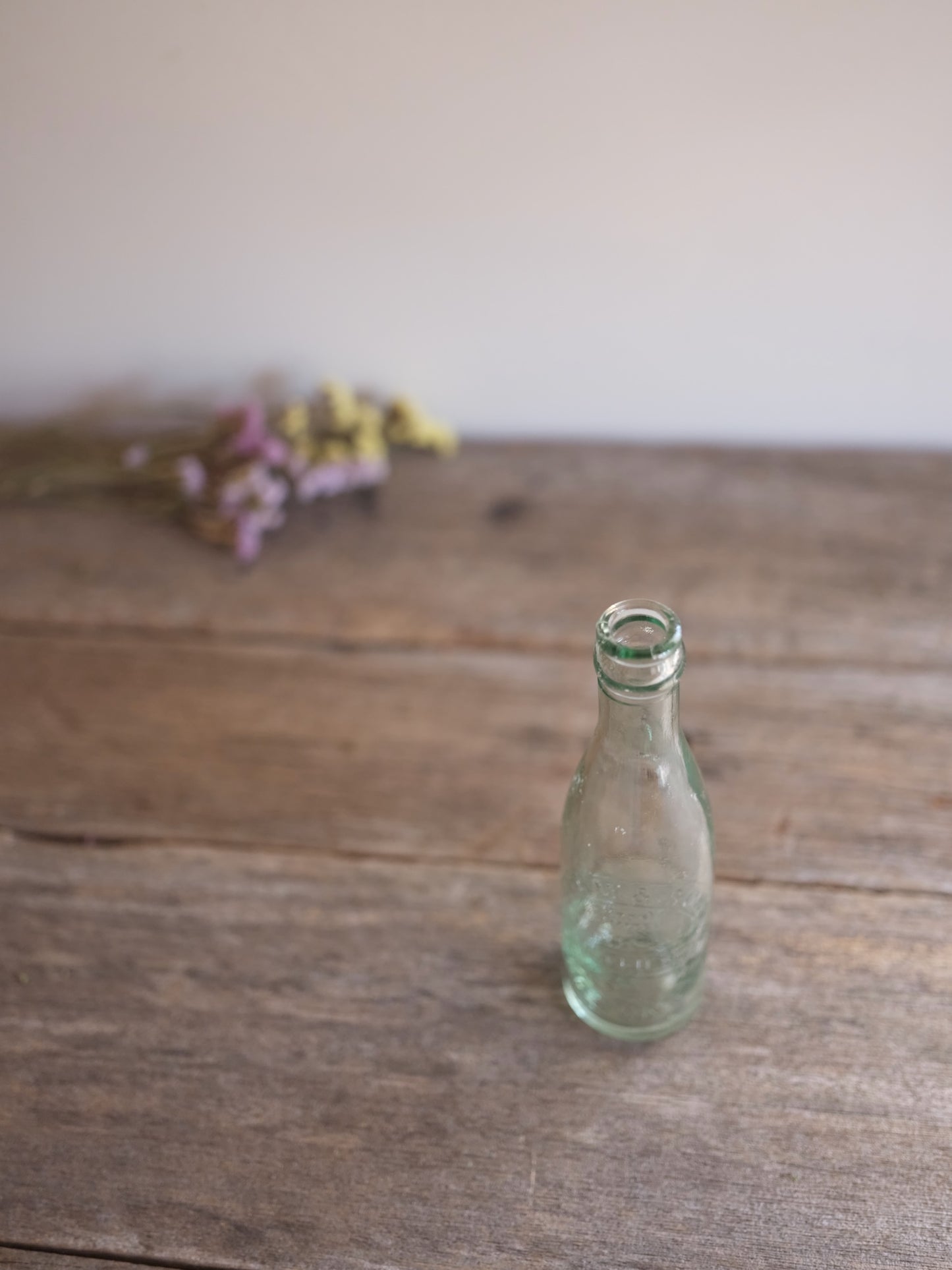 Cottam & Sons   Embossed Glass Bottle