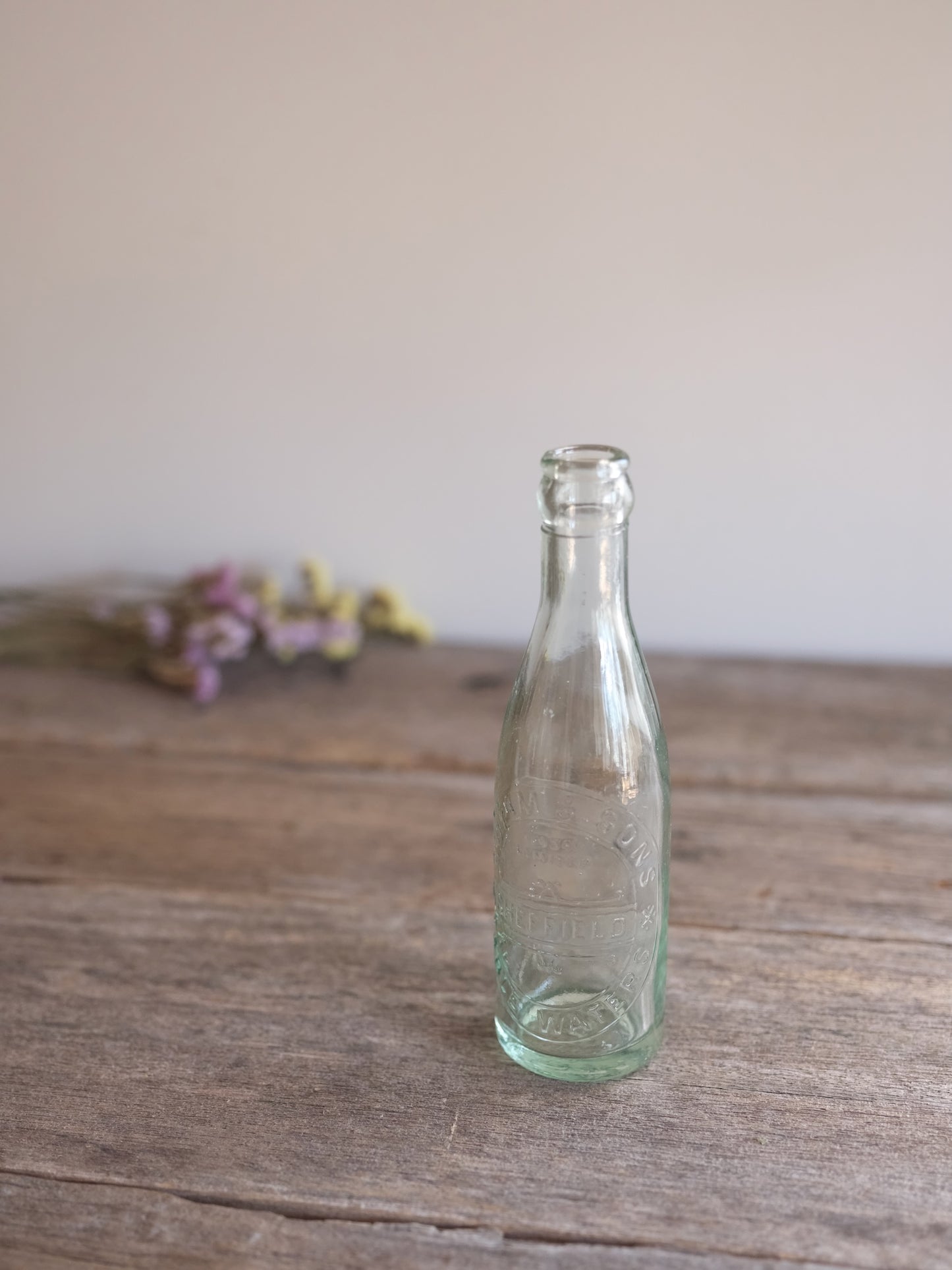Cottam & Sons   Embossed Glass Bottle